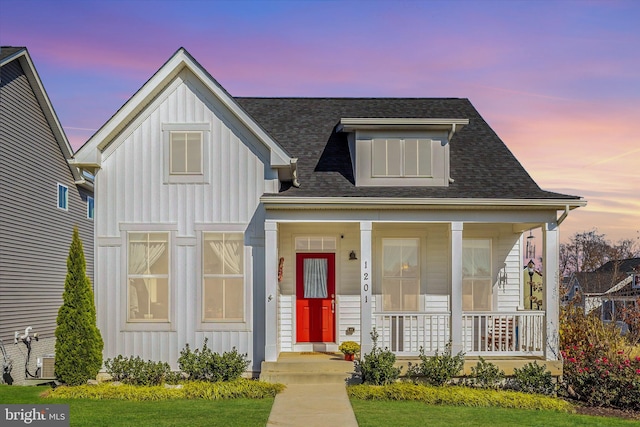 view of front of property featuring covered porch and central AC