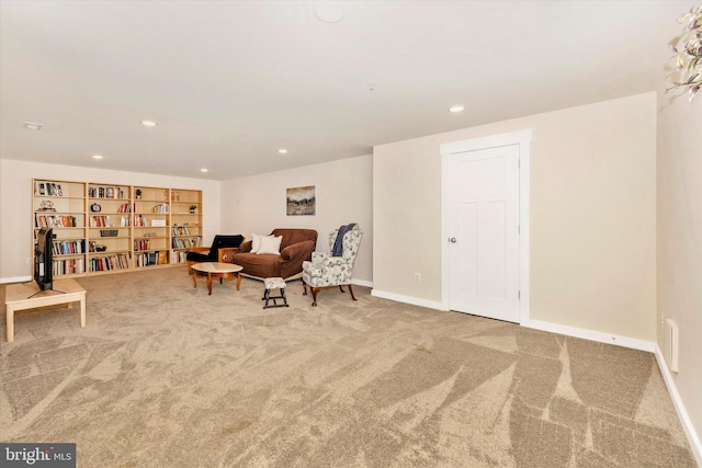 living area featuring carpet