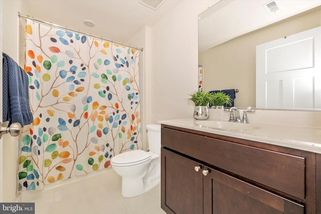 bathroom with tile patterned floors, vanity, and toilet