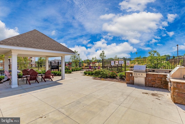 view of patio with a gazebo, area for grilling, and exterior kitchen