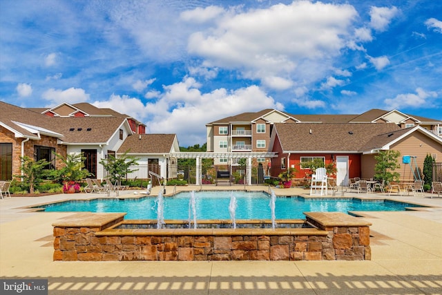 view of swimming pool featuring a pergola and a patio