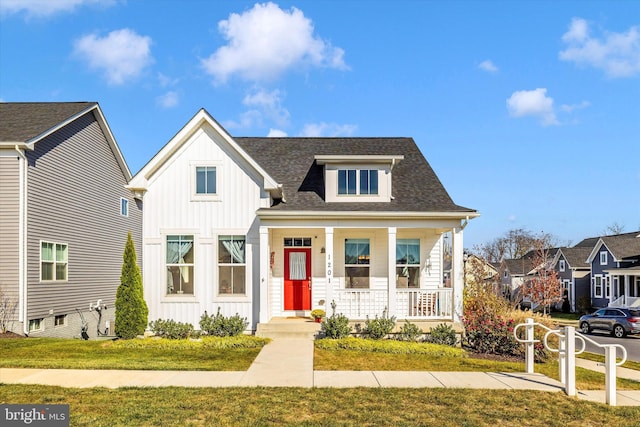 view of front of home featuring a front lawn and covered porch