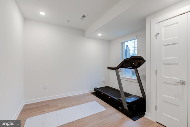 workout area featuring hardwood / wood-style floors