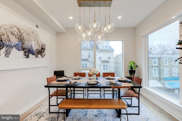 dining space featuring light wood-type flooring