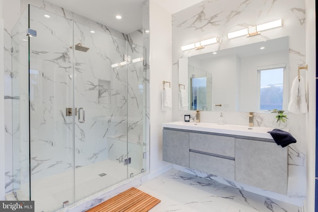 bathroom featuring vanity and a shower with shower door