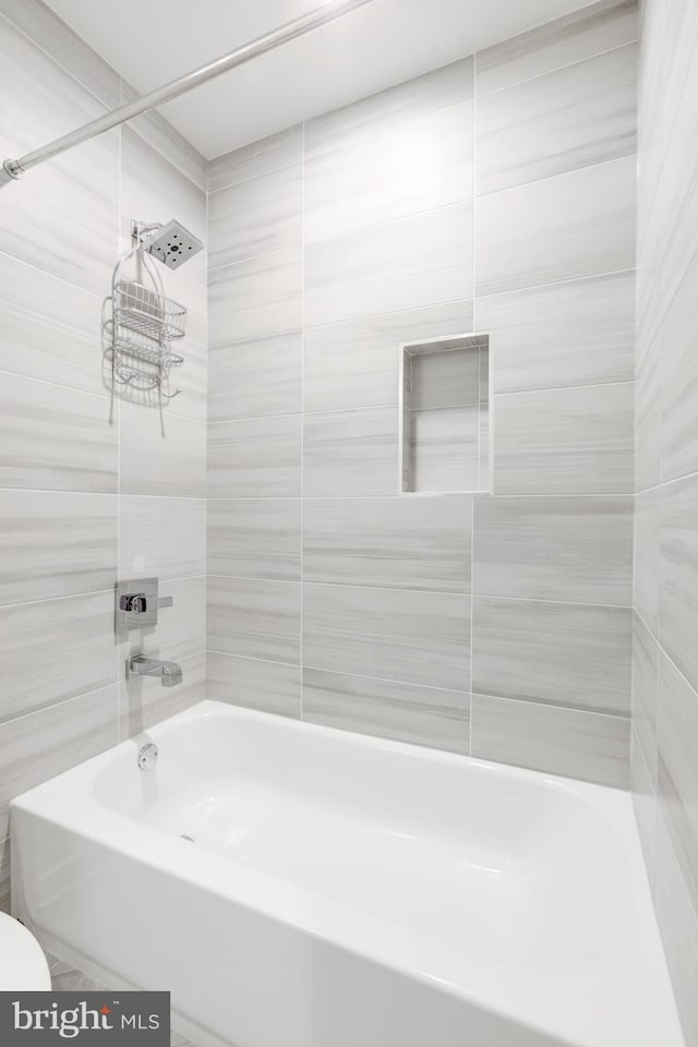 bathroom with shower / tub combination