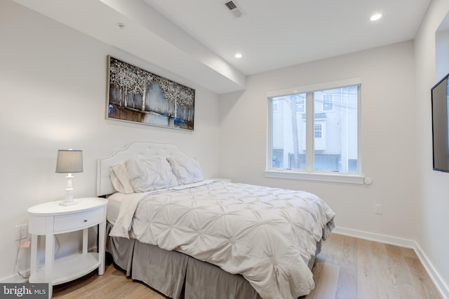 bedroom with light hardwood / wood-style floors