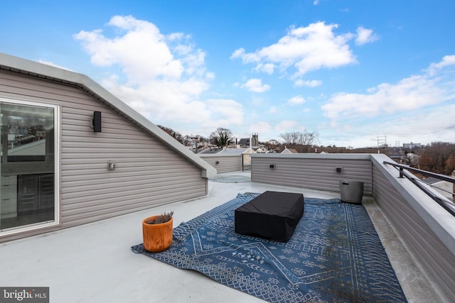 view of patio featuring a balcony