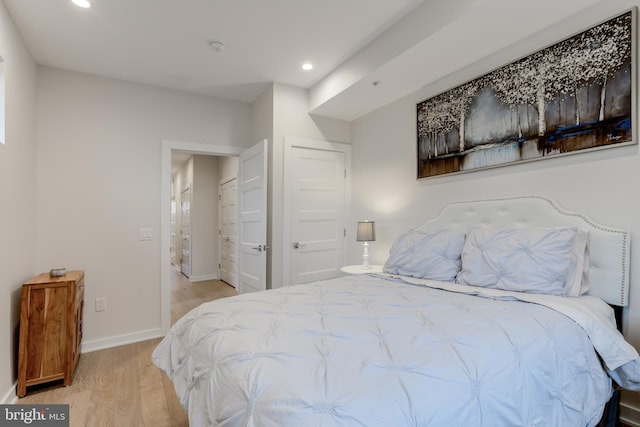 bedroom with light hardwood / wood-style floors