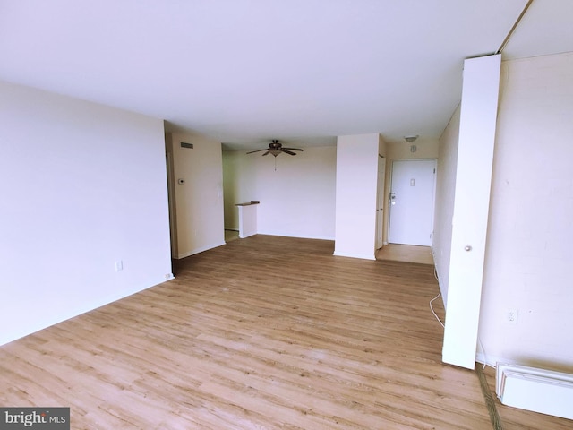 spare room with ceiling fan and light hardwood / wood-style floors