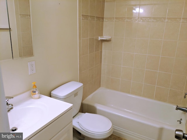 full bathroom featuring vanity, toilet, and tiled shower / bath