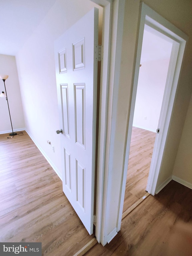 corridor featuring light hardwood / wood-style flooring