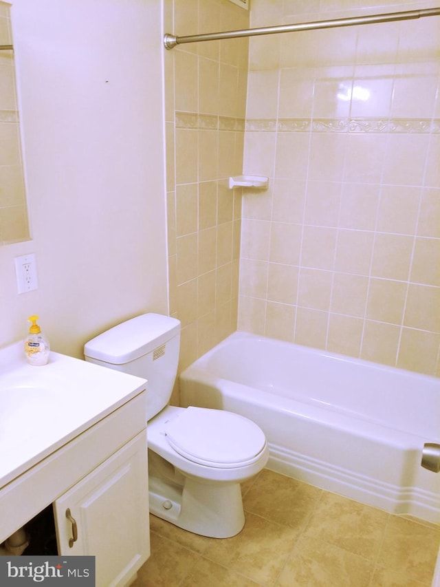 full bathroom with vanity, toilet, and tiled shower / bath