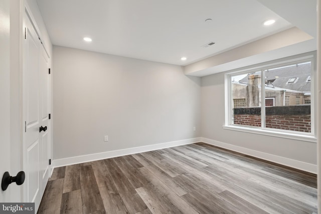 empty room featuring wood-type flooring