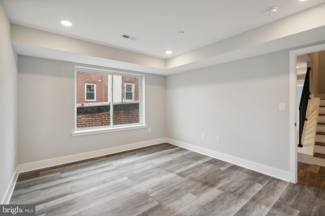 unfurnished room with light hardwood / wood-style flooring