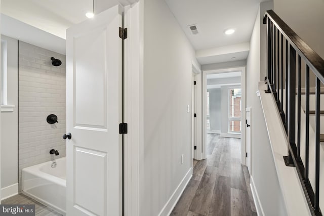 hallway with dark hardwood / wood-style flooring