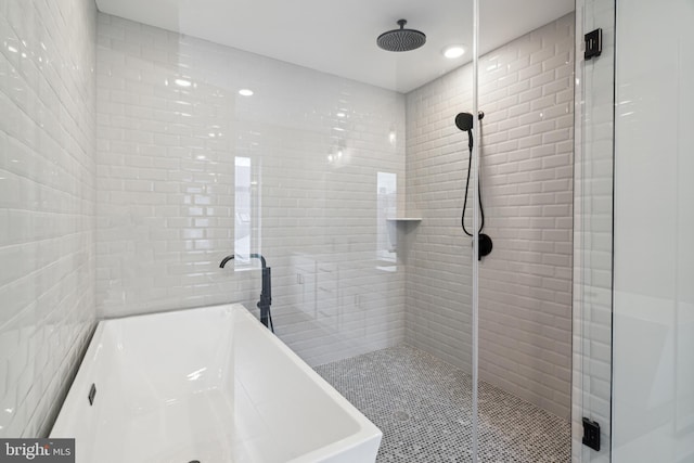 bathroom featuring sink and independent shower and bath