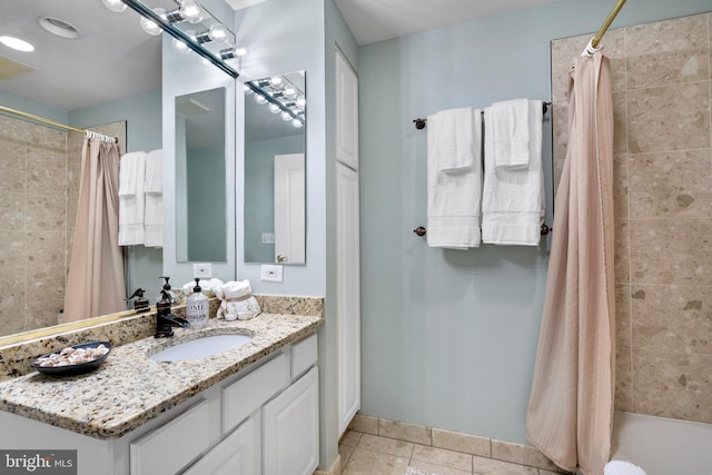 full bath featuring visible vents, tiled shower / bath combo, and vanity