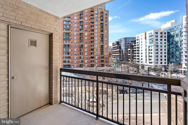 balcony featuring a view of city and visible vents