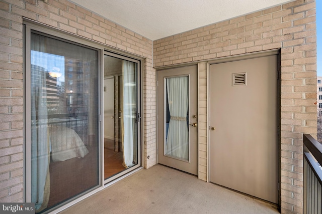 entrance to property featuring visible vents