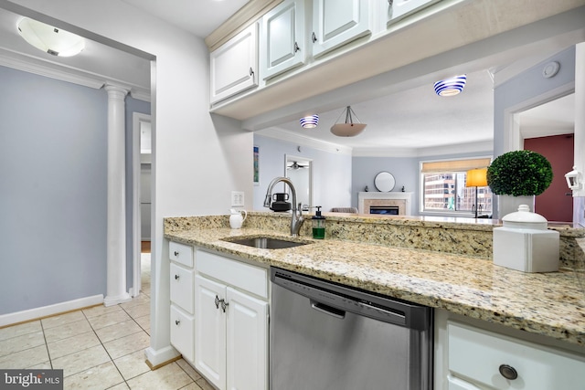 kitchen featuring stainless steel dishwasher, light tile patterned flooring, a sink, and crown molding