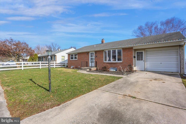 ranch-style house with a front yard and a garage