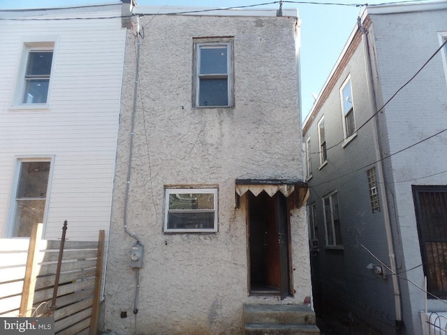 1252 N 56th St, Philadelphia, PA 19131 - view of front of home with stucco siding and fence