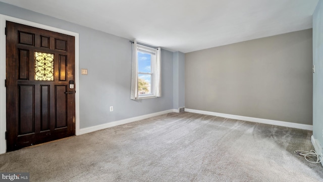 view of carpeted entrance foyer