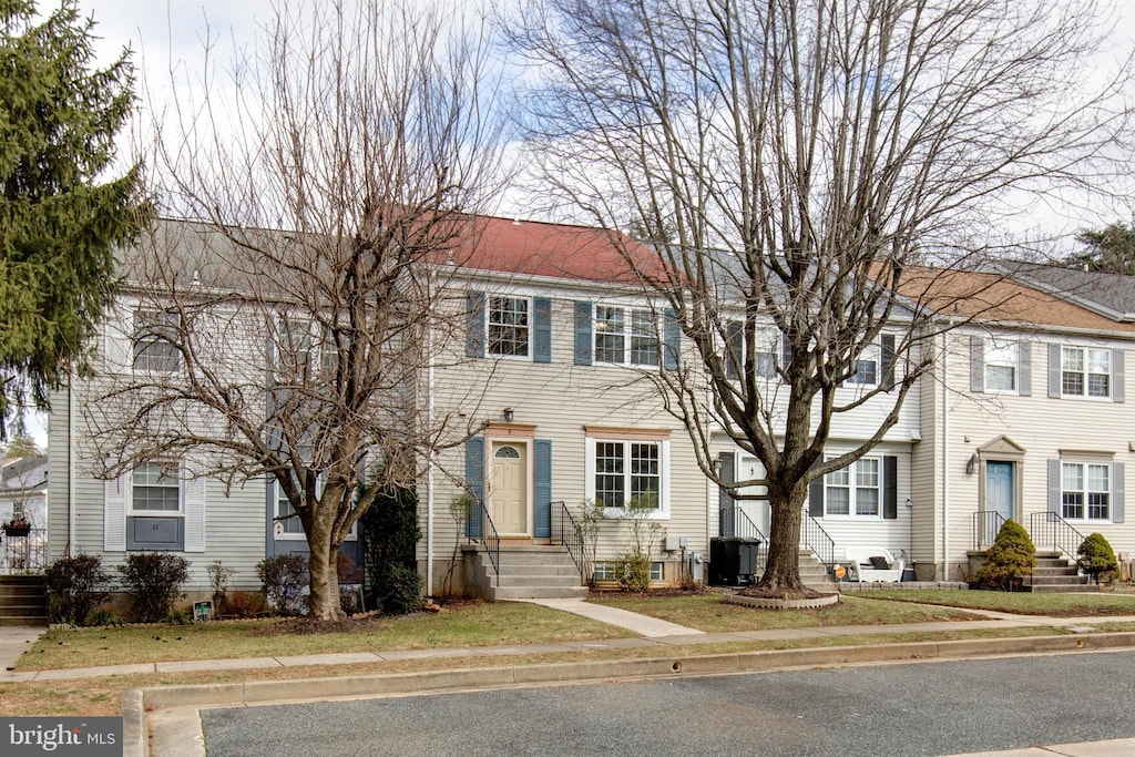 colonial home with central air condition unit