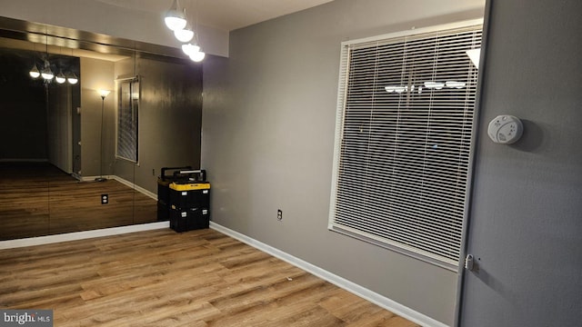 spare room featuring wood-type flooring