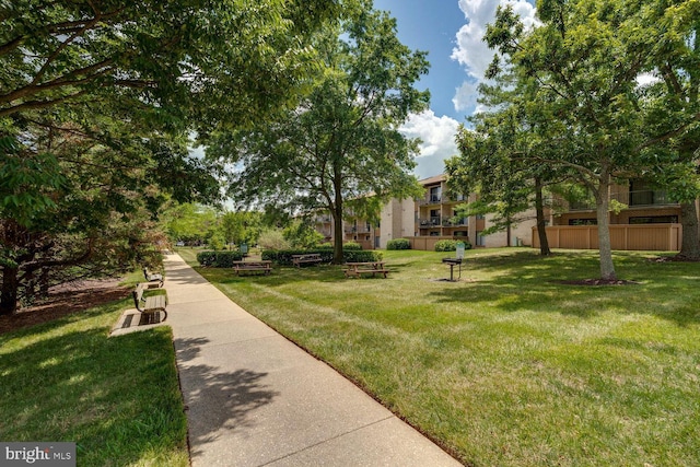 view of home's community featuring a yard