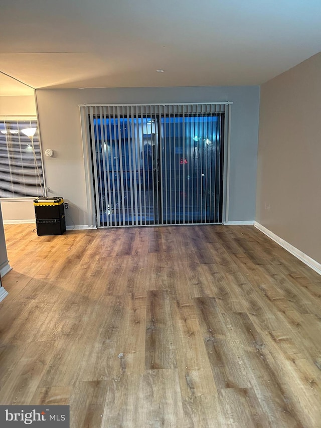 spare room with hardwood / wood-style floors