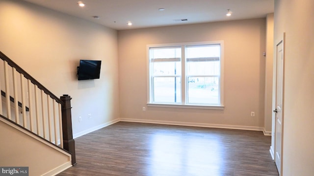 interior space featuring dark hardwood / wood-style flooring and a healthy amount of sunlight