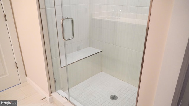 bathroom featuring tile patterned floors and walk in shower