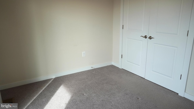 unfurnished bedroom with carpet