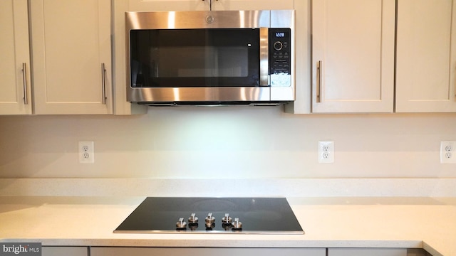 kitchen with black electric cooktop