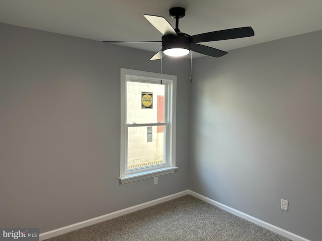 empty room with carpet floors and ceiling fan