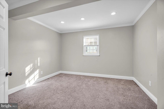 unfurnished room with carpet floors and crown molding