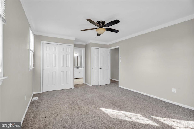 unfurnished bedroom with carpet flooring, ceiling fan, and ornamental molding