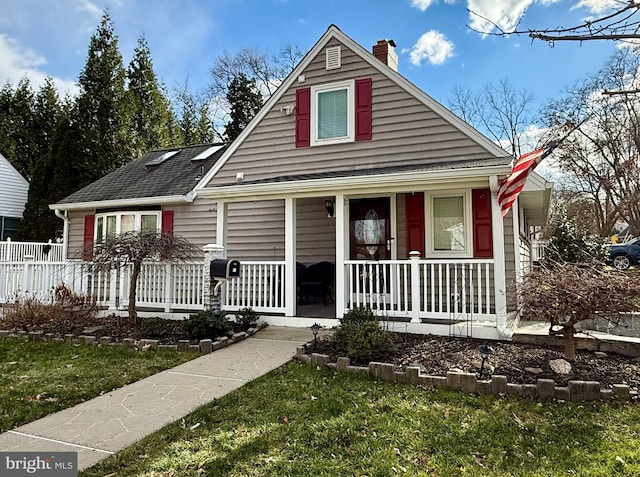 bungalow-style house with a front lawn