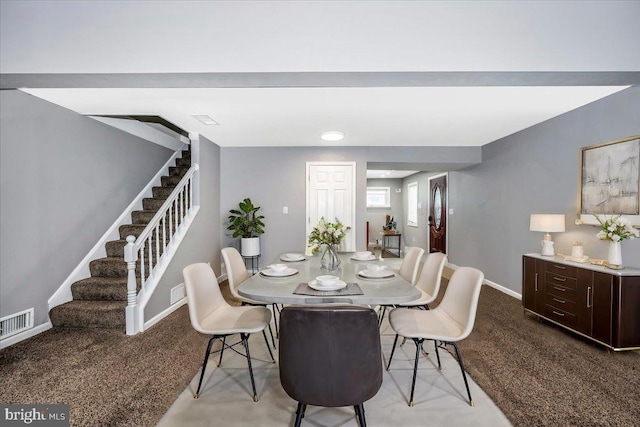 dining area with light colored carpet