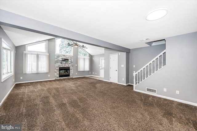 unfurnished living room featuring carpet, ceiling fan, and lofted ceiling