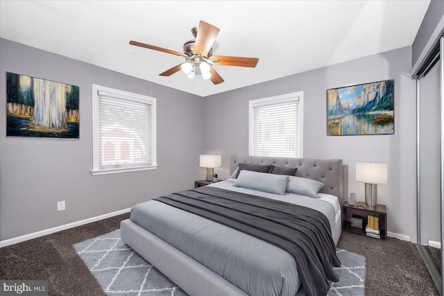 carpeted bedroom with ceiling fan and a closet