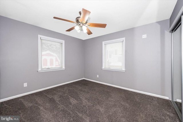 empty room with carpet and ceiling fan