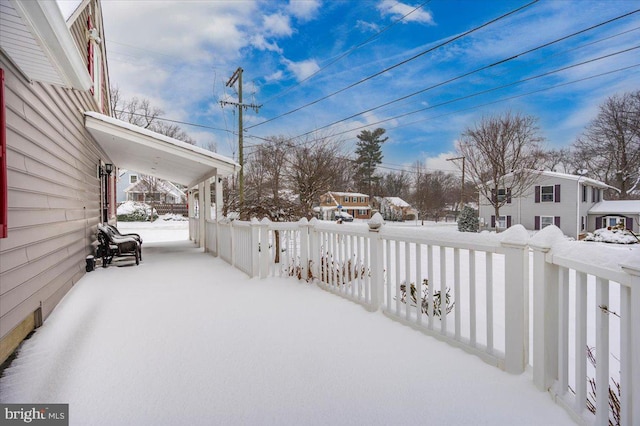 view of snow covered patio