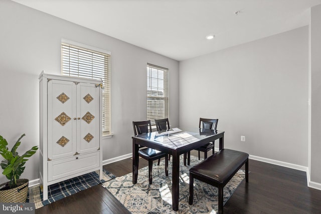 dining space with dark wood-type flooring