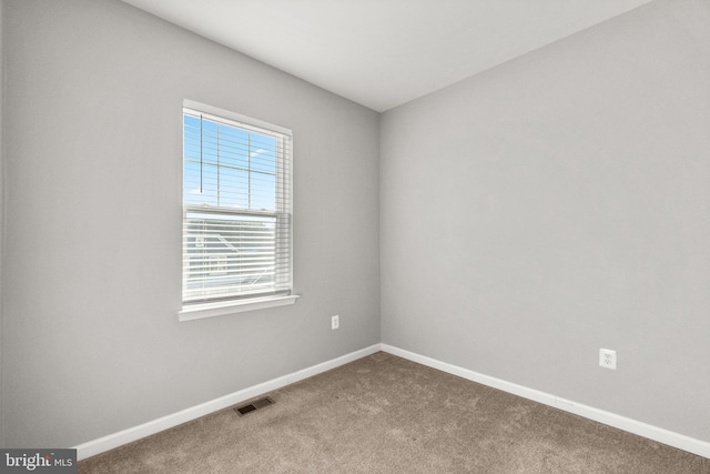 view of carpeted spare room