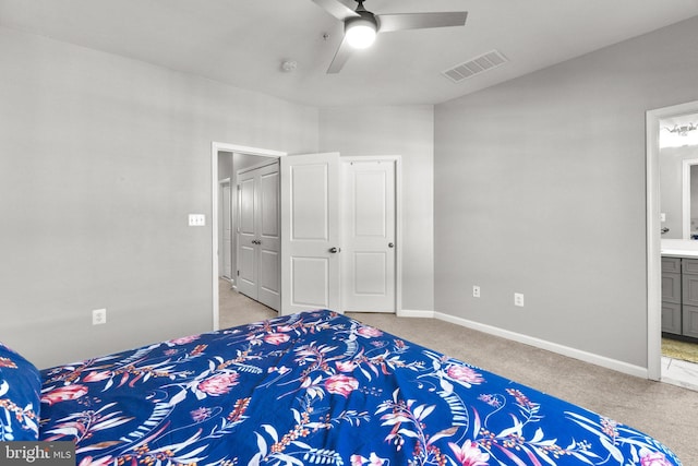 carpeted bedroom with ceiling fan and connected bathroom