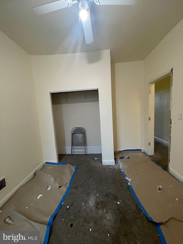 unfurnished living room featuring ceiling fan