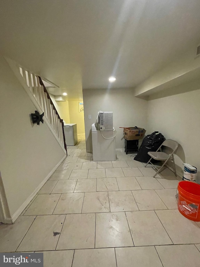 basement with light tile patterned flooring